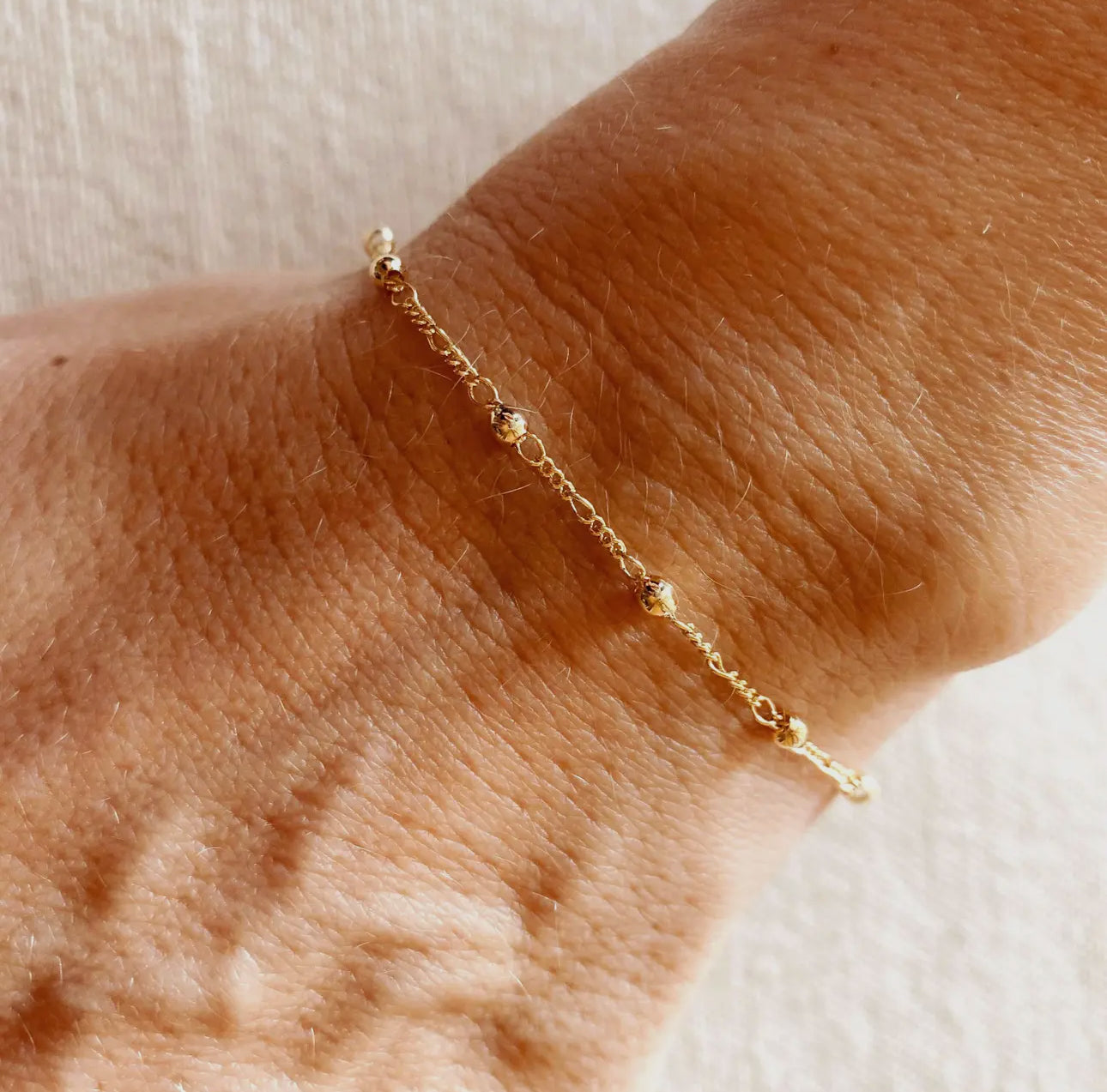 18k gold filled beaded bracelet with cross charm