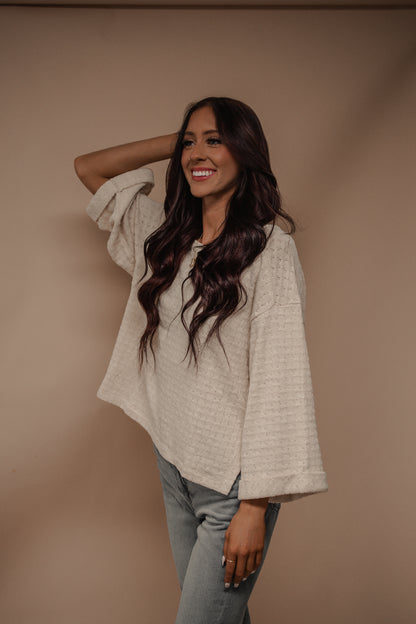 cream wide sleeve knit top